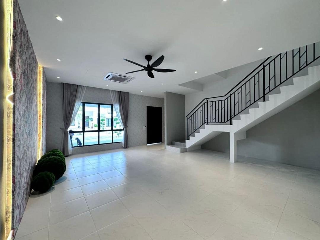 Show unit living area with the staircase and feature wall